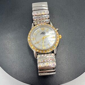 Kirks Folly Quartz Woman's Gold Tone Iridescent Stone Embellished
Stretchy Watch